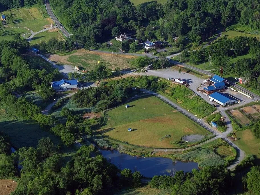 An aerial shot of the entire Blue Arrow property in summer